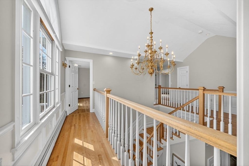 792 A Jerusalem Road Cohasset, MA 02025 - Photo 31 of 42 a view of a chandelier and wooden floor in a corridor
