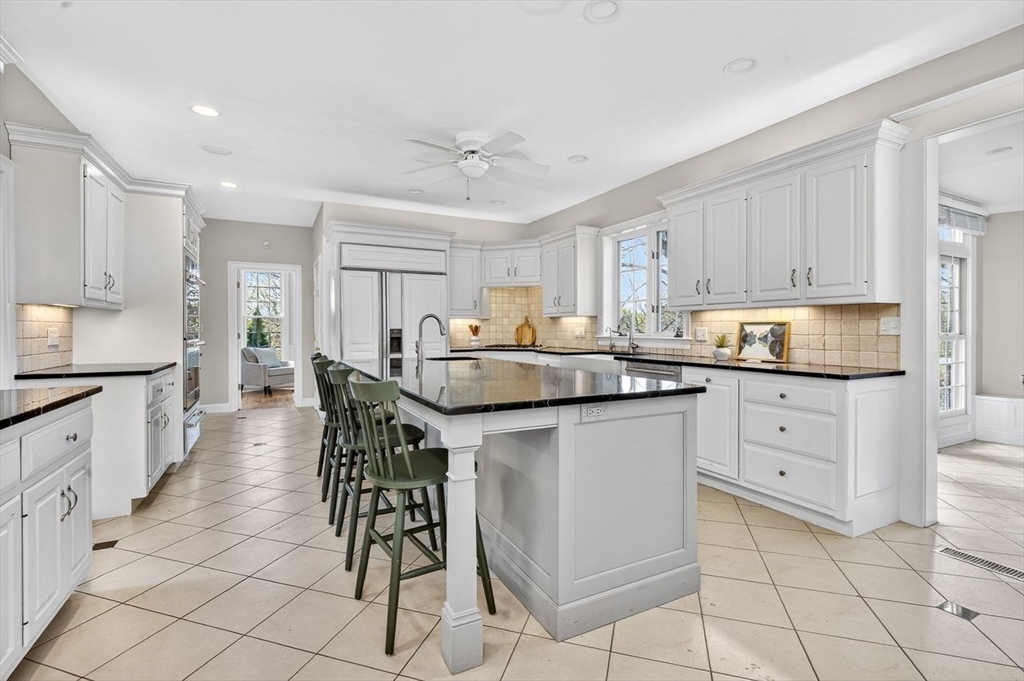792 A Jerusalem Road Cohasset, MA 02025 - Photo 10 of 42 a kitchen with granite countertop cabinets a sink a counter space and stainless steel appliances