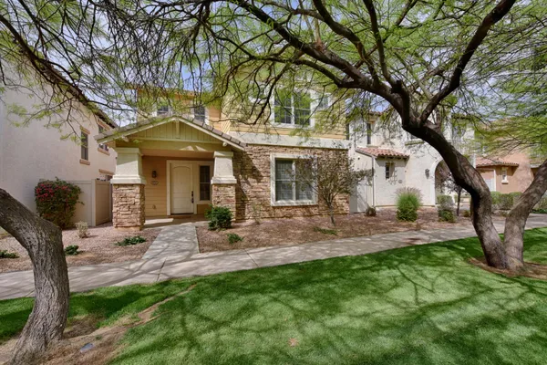 a view of a house with backyard porch and sitting area