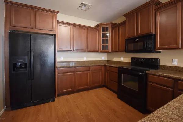 a kitchen with a sink a stove and a refrigerator