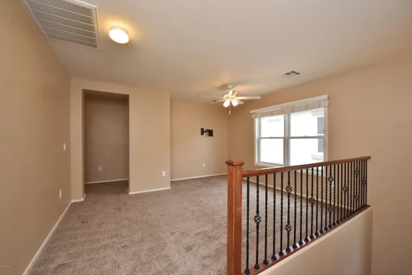 a view of a hallway with windows