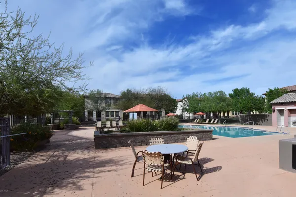 a view of house with outdoor space and sitting area