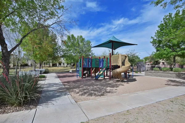 a view of a park with sitting area