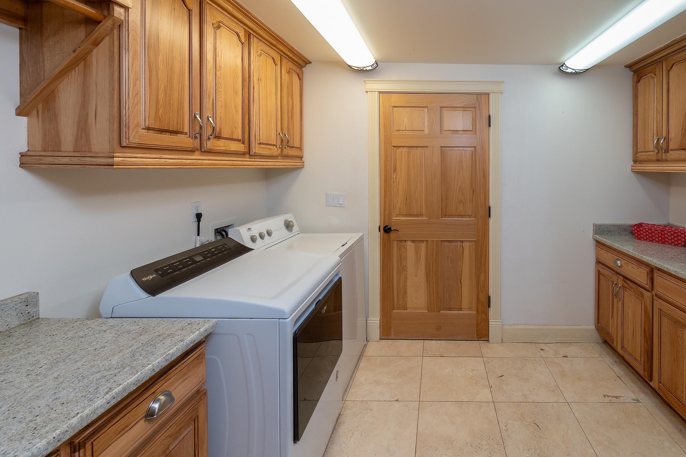 59047 Old Lake Road Christmas Valley, OR 97641 - Photo 29 of 55 Laundry with spacious cabinets and granite counter tops