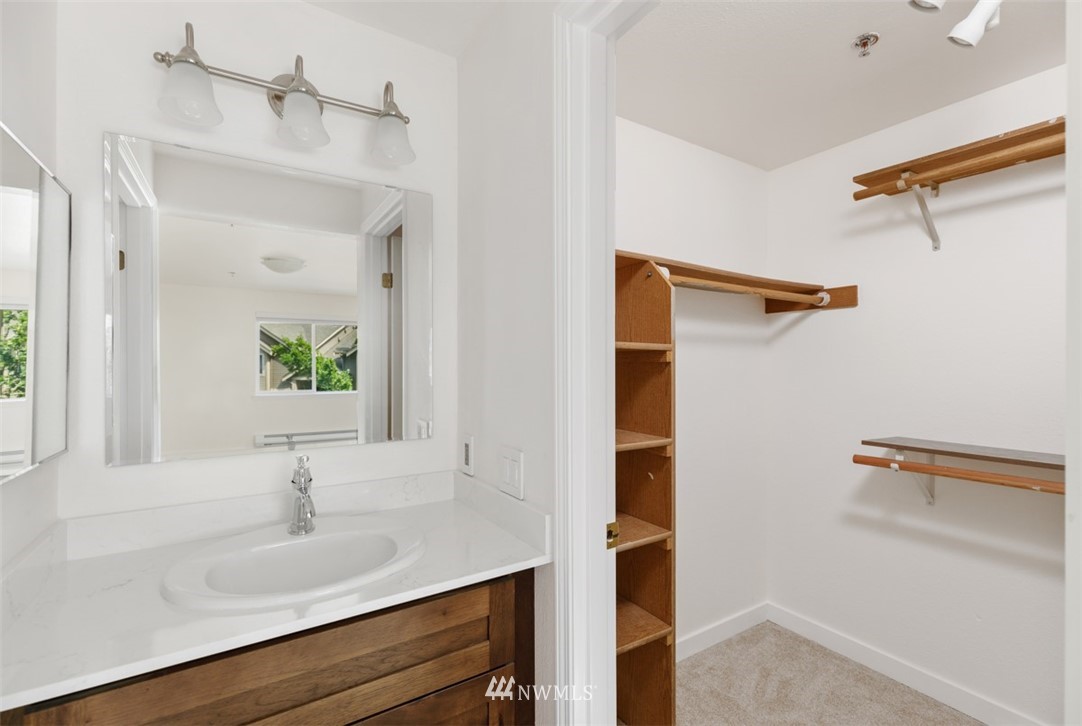 19410 Bothell Way Northeast, Unit D301 Bothell, WA 98011 - Photo 12 of 18 a bathroom with a sink and a mirror