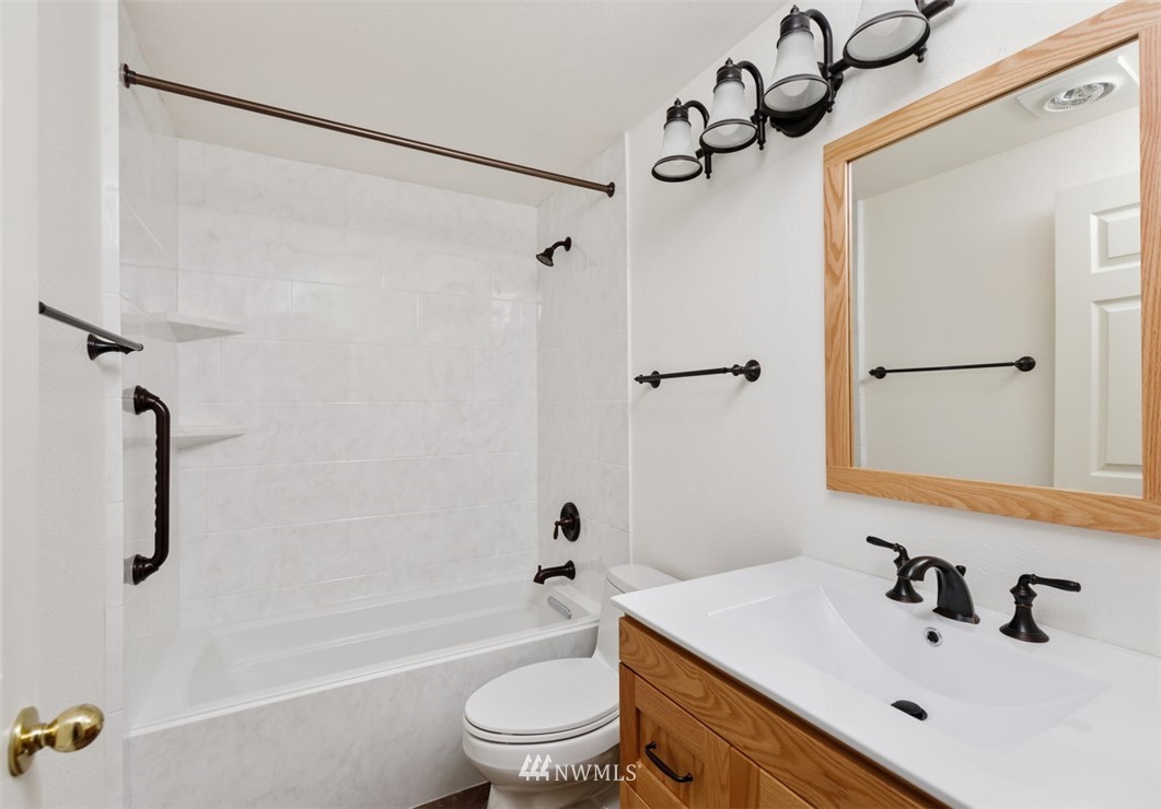 19410 Bothell Way Northeast, Unit D301 Bothell, WA 98011 - Photo 15 of 18 a bathroom with a sink toilet and shower