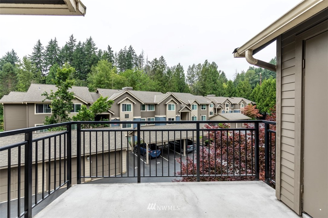 19410 Bothell Way Northeast, Unit D301 Bothell, WA 98011 - Photo 18 of 18 a view of a wooden house with a small yard