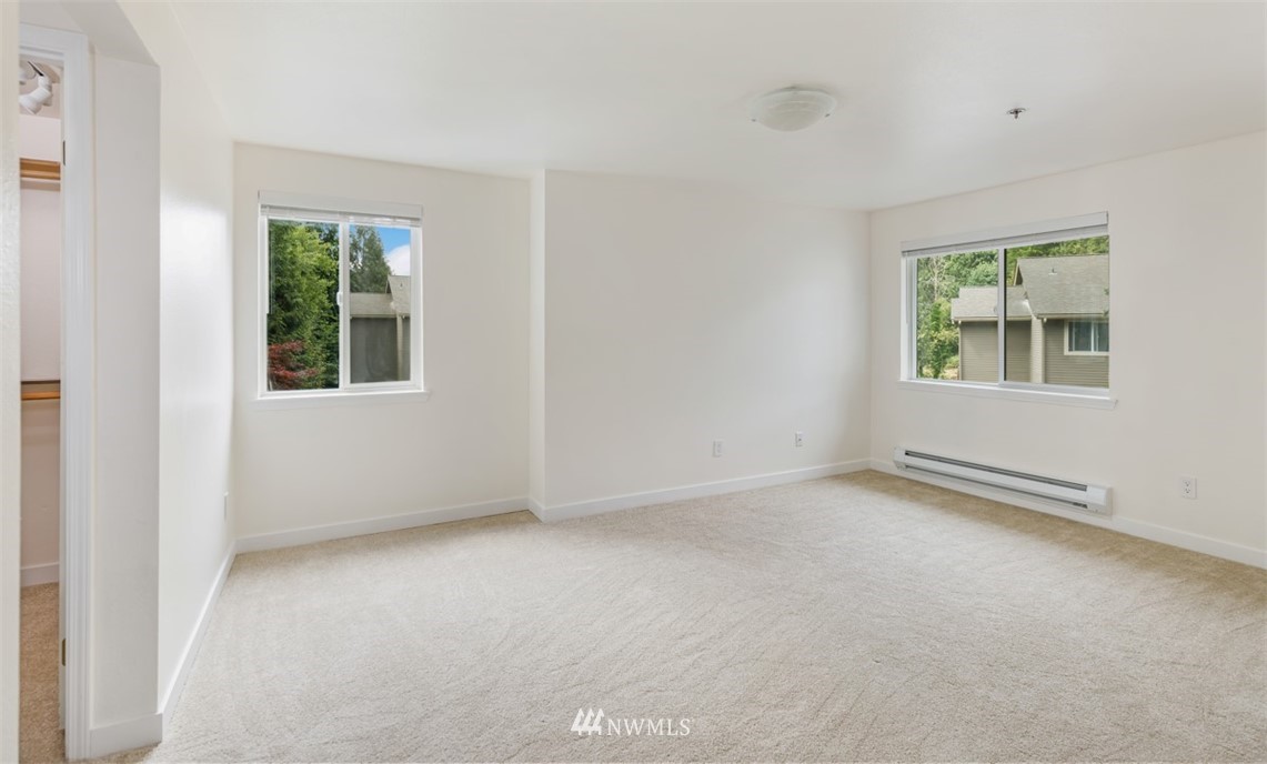 19410 Bothell Way Northeast, Unit D301 Bothell, WA 98011 - Photo 9 of 18 an empty room with windows
