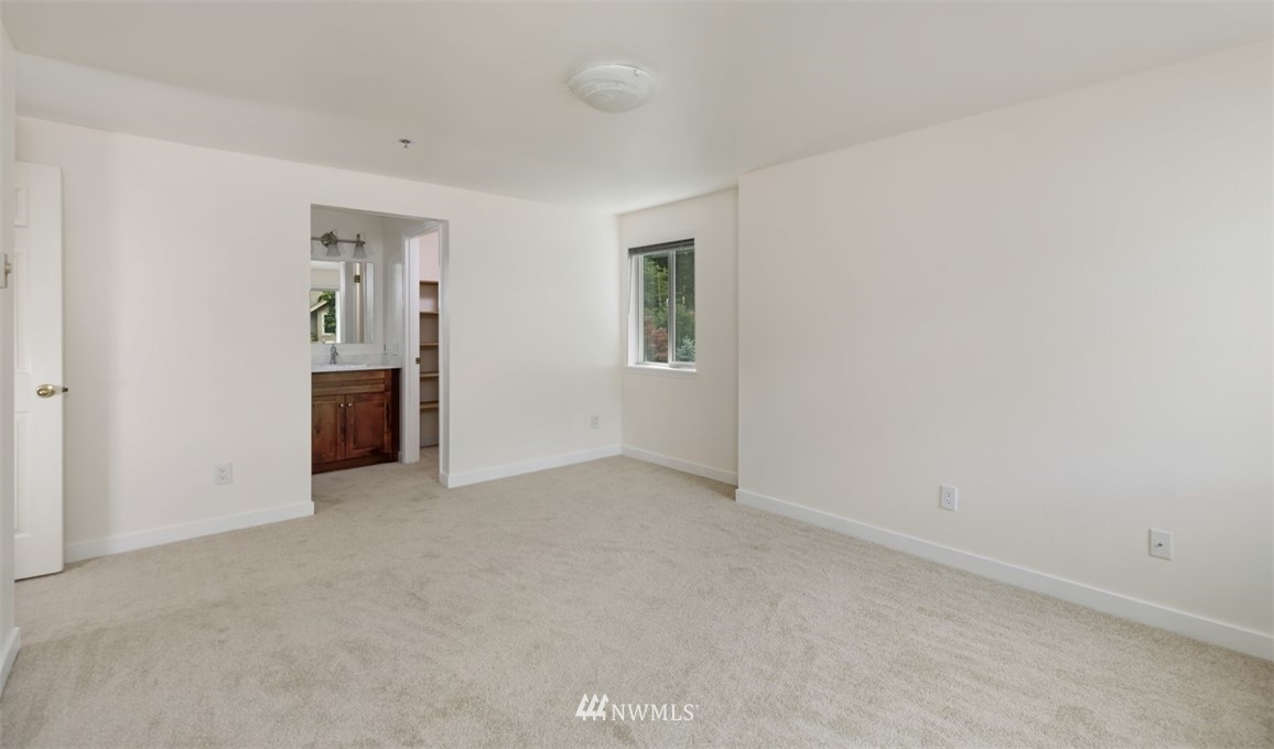 19410 Bothell Way Northeast, Unit D301 Bothell, WA 98011 - Photo 10 of 18 an empty room with windows