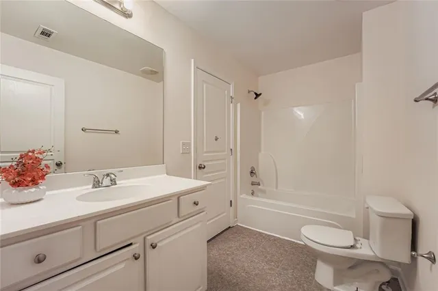 a spacious bedroom with a large bed and a window