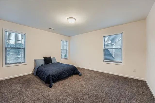 a view of balcony with wooden floor and outdoor seating