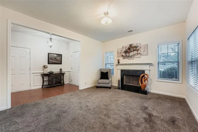a view of livingroom with furniture and a fireplace