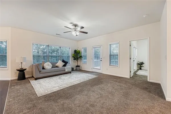 a living room with furniture and a window
