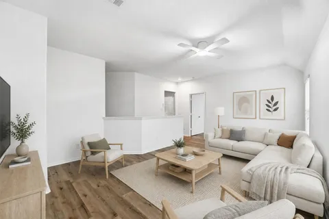 a living room with furniture and a table