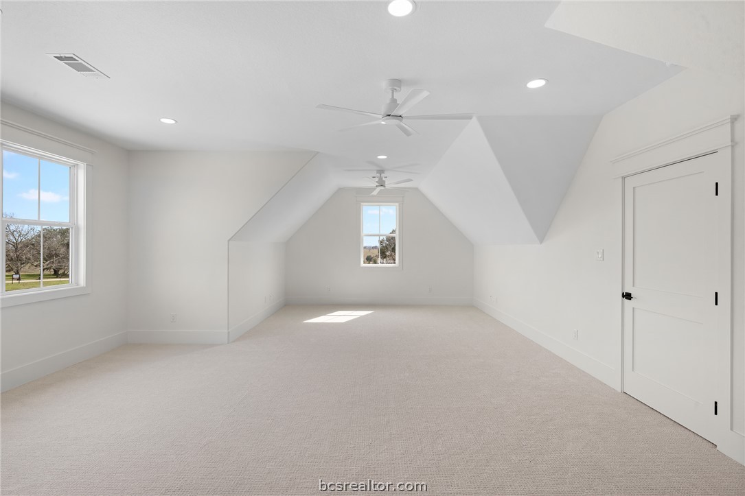 424 Pleasant Hill School Road Brenham, TX 77833 - Photo 21 of 26 The home is 1.5 stories, so attic access is a breeze + this Bonus Space is an unexpected and pleasant surprise! It has its own full bathroom, and could serve as a 5th bedroom, second office, or guest space. Loads of possibility!
