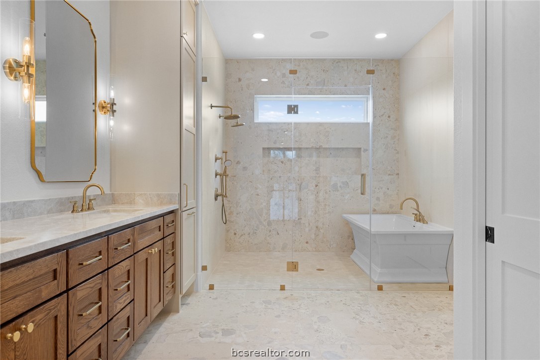 424 Pleasant Hill School Road Brenham, TX 77833 - Photo 6 of 26 The Owner's Bathroom is large and luxurious and boasts a wet room that encloses a double shower and the tub.
