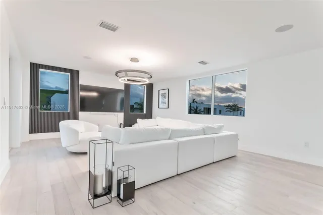 an empty room with floor to ceiling window