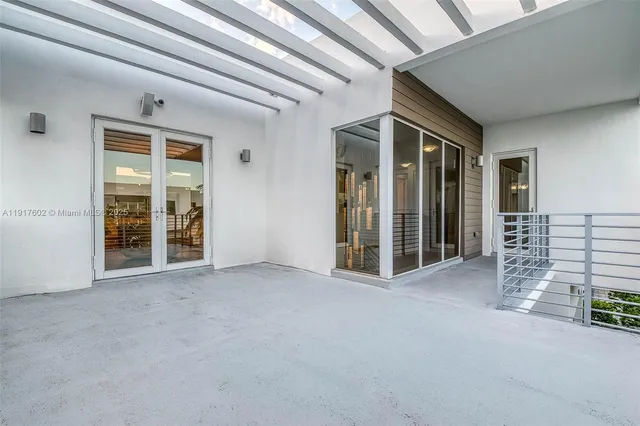 a large white bed in a white room