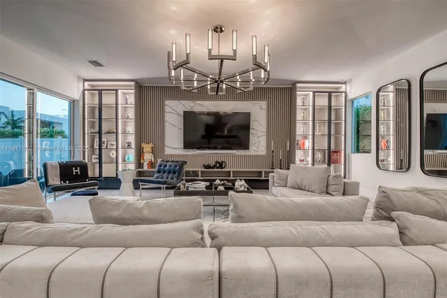 a dining room with chandelier and outdoor view