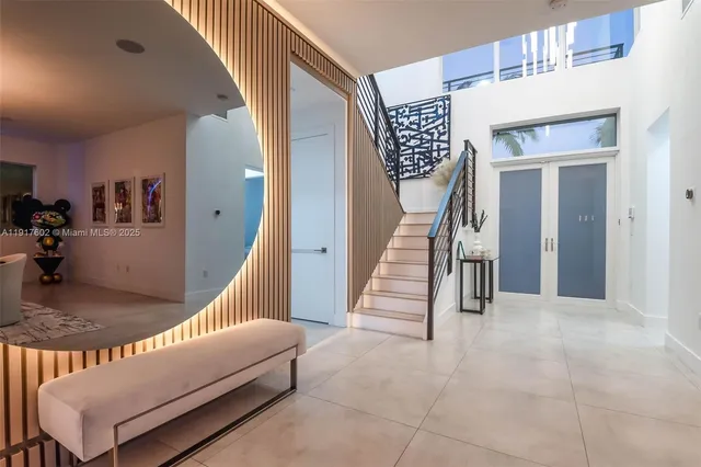 a view of a entryway with a table and chairs