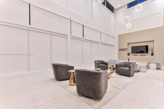 a view of a dining room with furniture and a large window