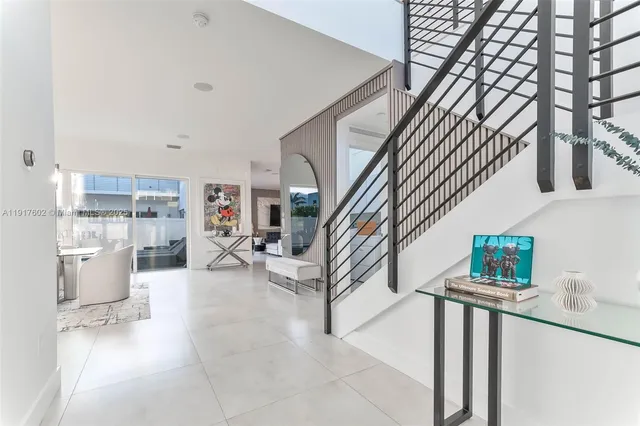 en suite bathroom with a sink mirror and vanity