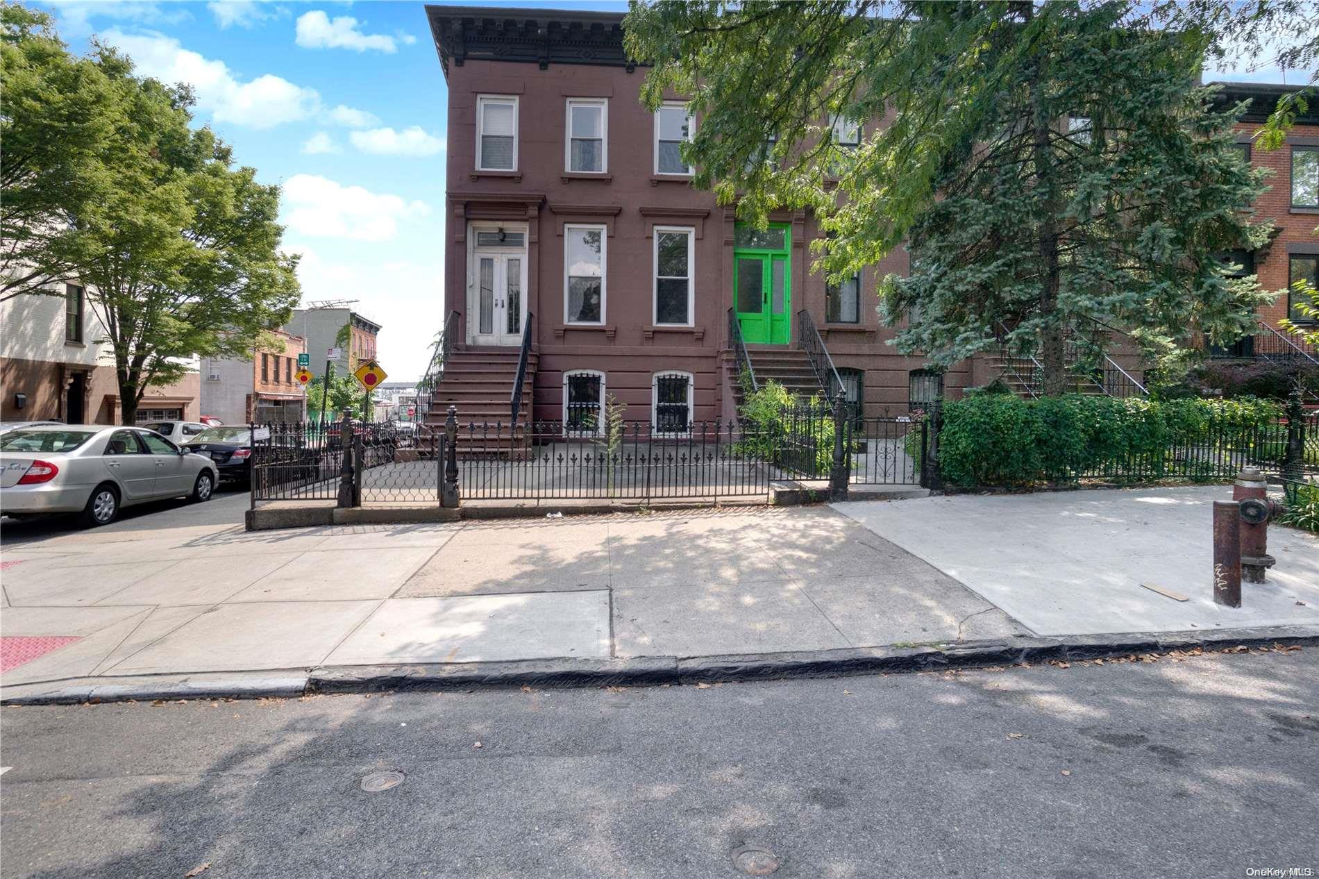 64 2nd Street Brooklyn, NY 11231 - Photo 1 of 1 a front view of a building with garden and trees