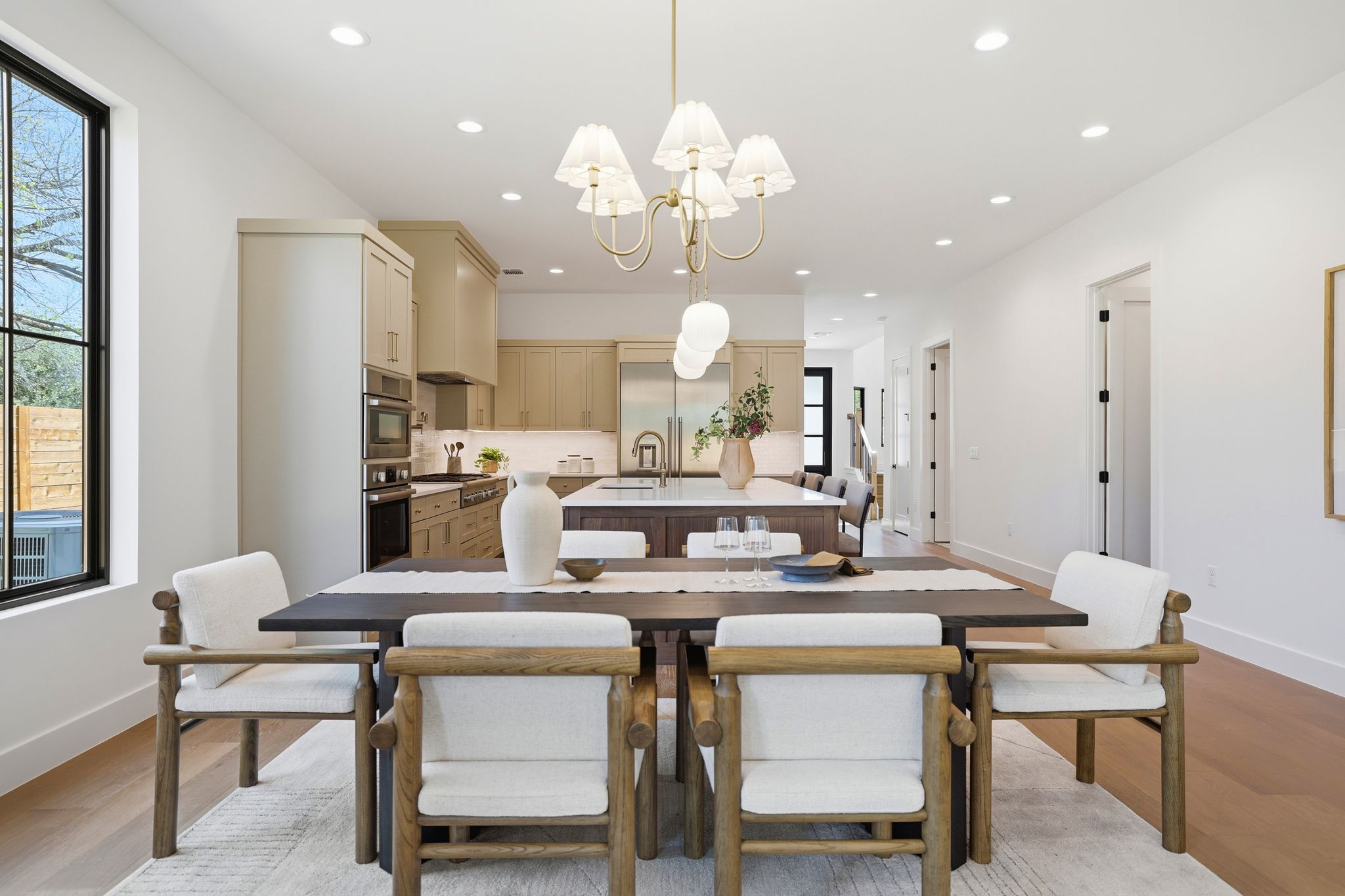 4500 Jinx Avenue Austin, TX 78745 - Photo 15 of 40 Dining room featuring light wood finished floors and a chandelier