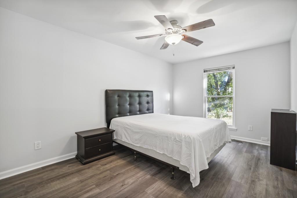 10145 Rillridge Court Alpharetta, GA 30022 - Photo 13 of 26 a bedroom with a bed and a window