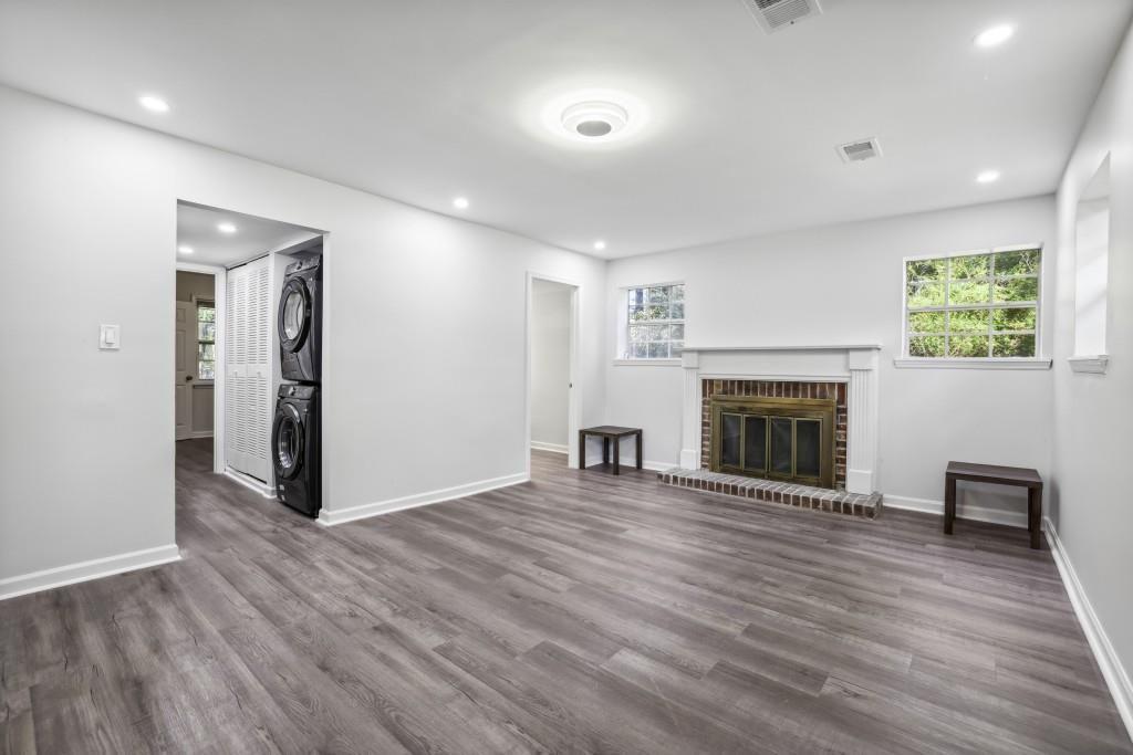 10145 Rillridge Court Alpharetta, GA 30022 - Photo 16 of 26 a view of a livingroom with wooden floor and a fireplace