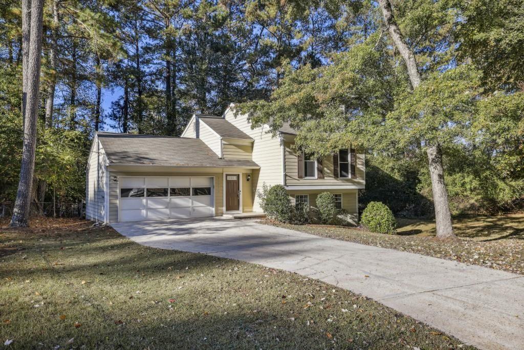 10145 Rillridge Court Alpharetta, GA 30022 - Photo 2 of 26 a front view of a house with a yard