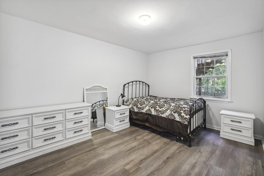10145 Rillridge Court Alpharetta, GA 30022 - Photo 23 of 26 a bedroom with a bed and a window