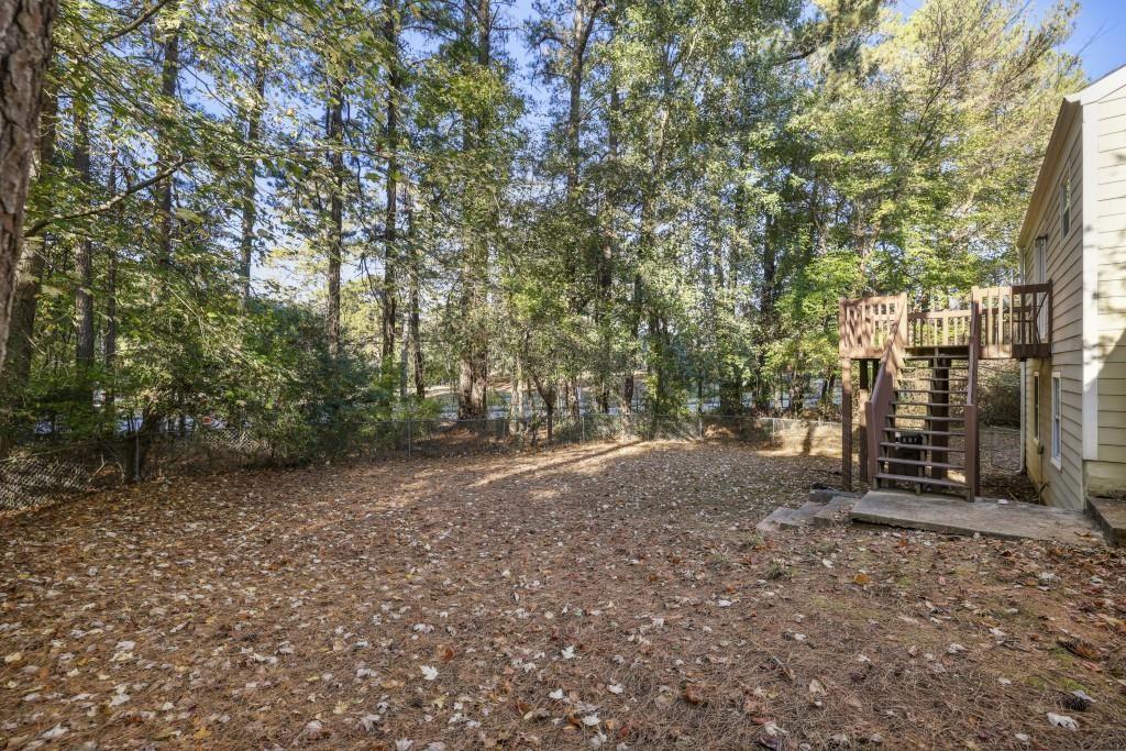 10145 Rillridge Court Alpharetta, GA 30022 - Photo 25 of 26 a view of a forest with trees in the background