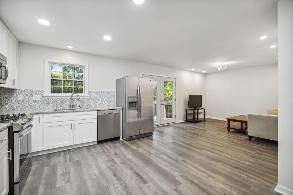 10145 Rillridge Court Alpharetta, GA 30022 - Photo 5 of 26 a kitchen with sink and refrigerator