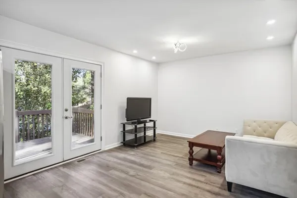 a view of livingroom with furniture and a flat screen tv