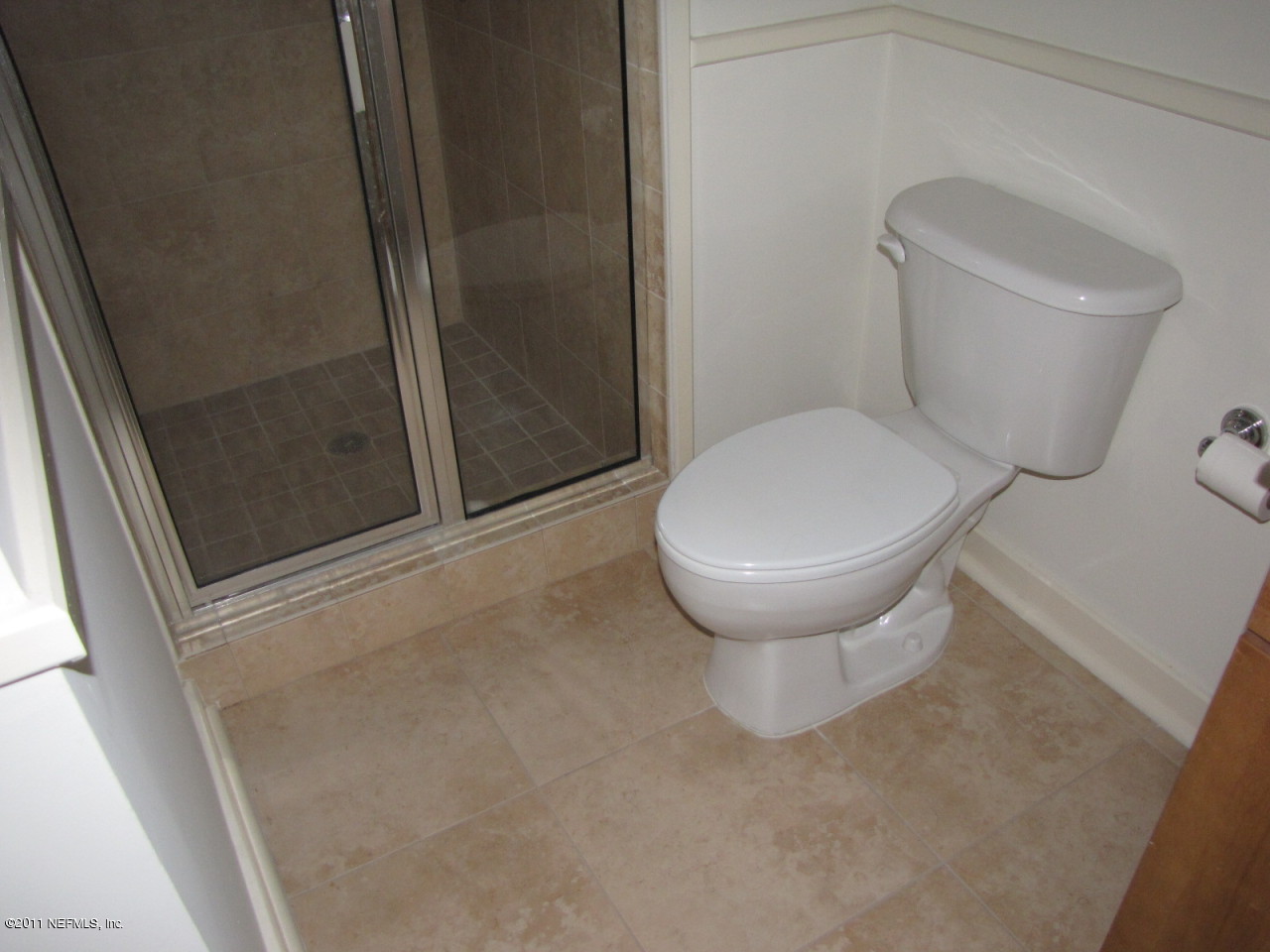 1661 Riverside Avenue, Unit 203 Jacksonville, FL 32204 - Photo 7 of 11 a bathroom with a toilet and a shower