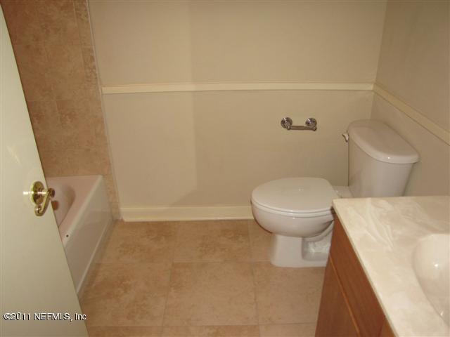 1661 Riverside Avenue, Unit 203 Jacksonville, FL 32204 - Photo 9 of 11 a bathroom with a toilet and a shower