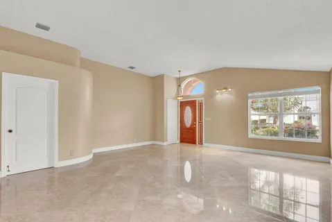 a kitchen with stainless steel appliances granite countertop a stove and a refrigerator