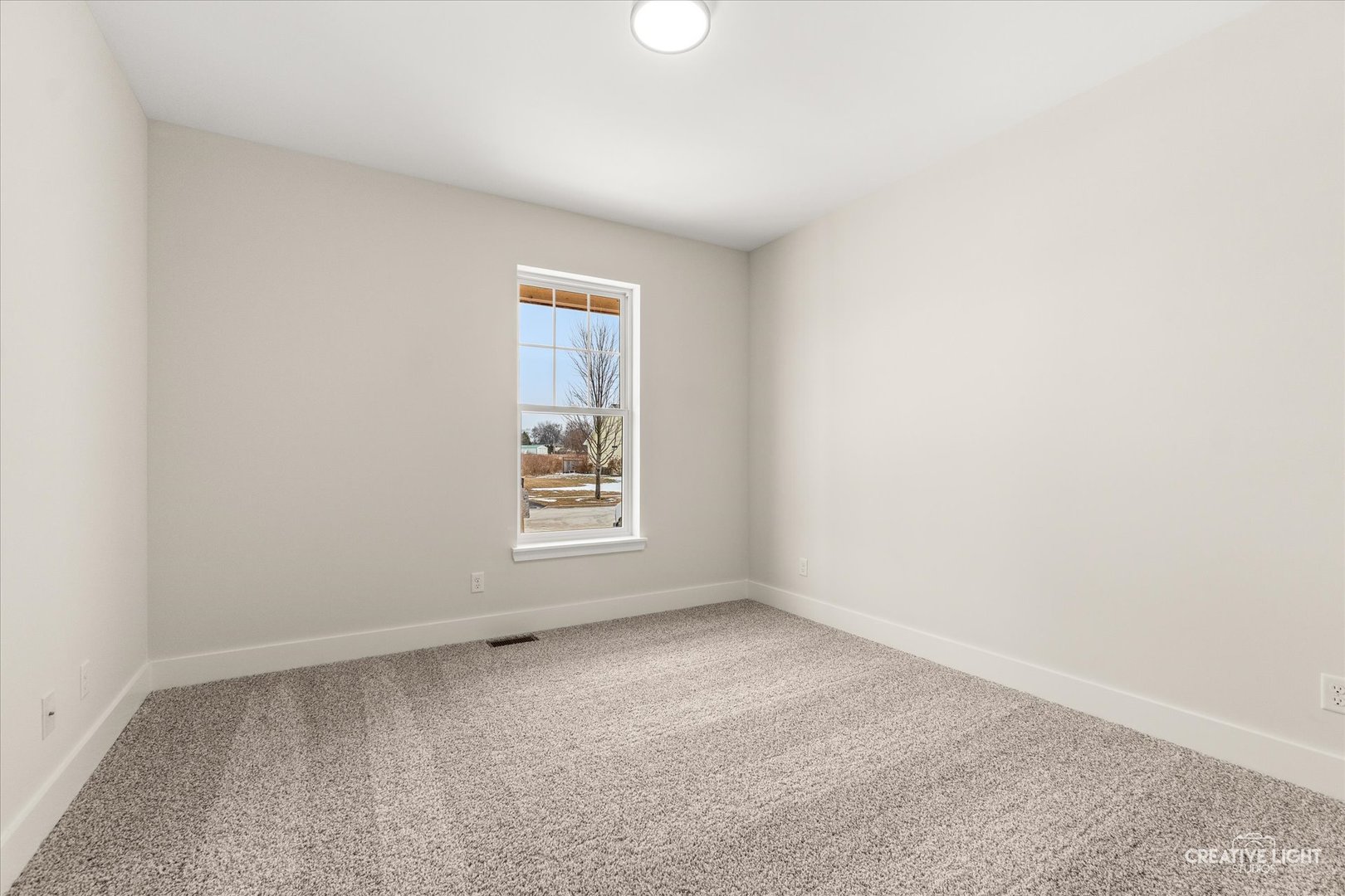 1823 Constitution Street Sycamore, IL 60178 - Photo 12 of 18 an empty room with a window