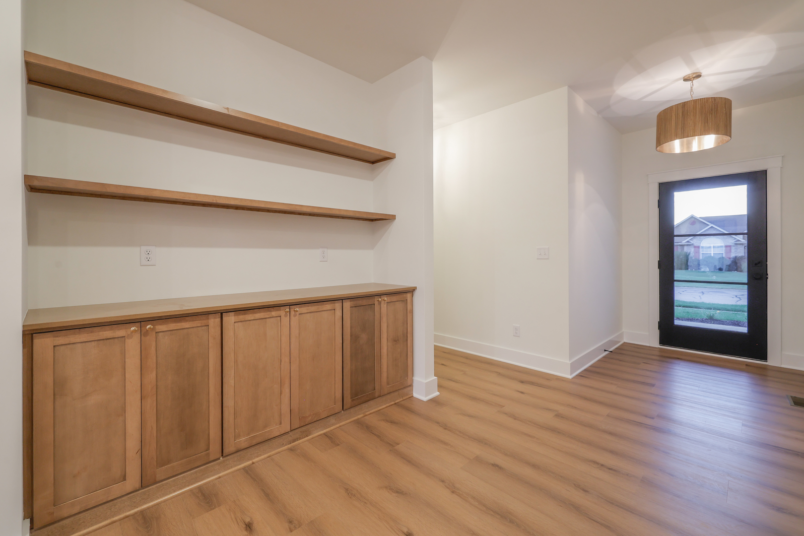 1823 Constitution Street Sycamore, IL 60178 - Photo 15 of 26 a view of an empty room with wooden floor