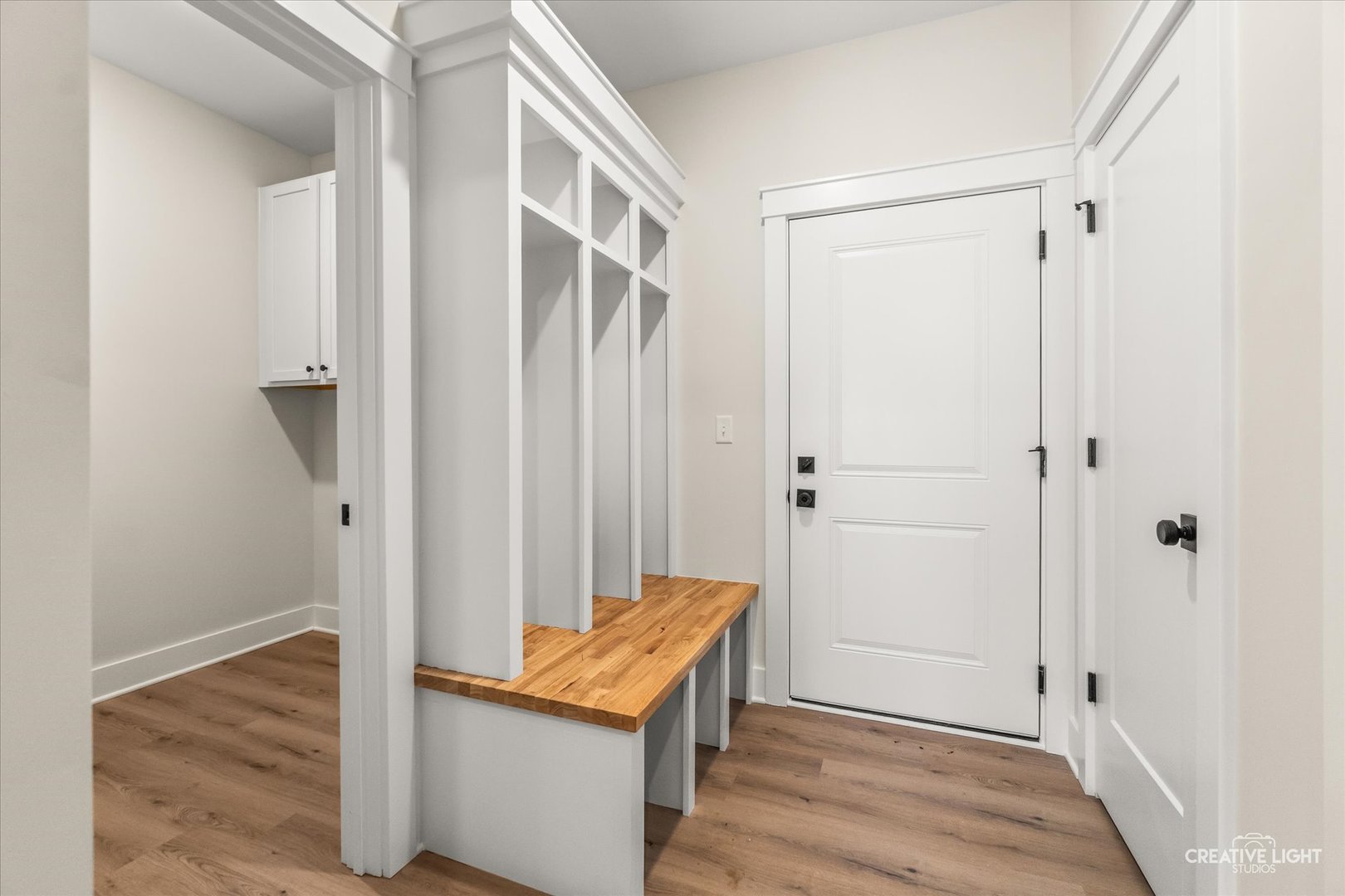 1823 Constitution Street Sycamore, IL 60178 - Photo 18 of 18 a view of a hallway with wooden floor and staircase