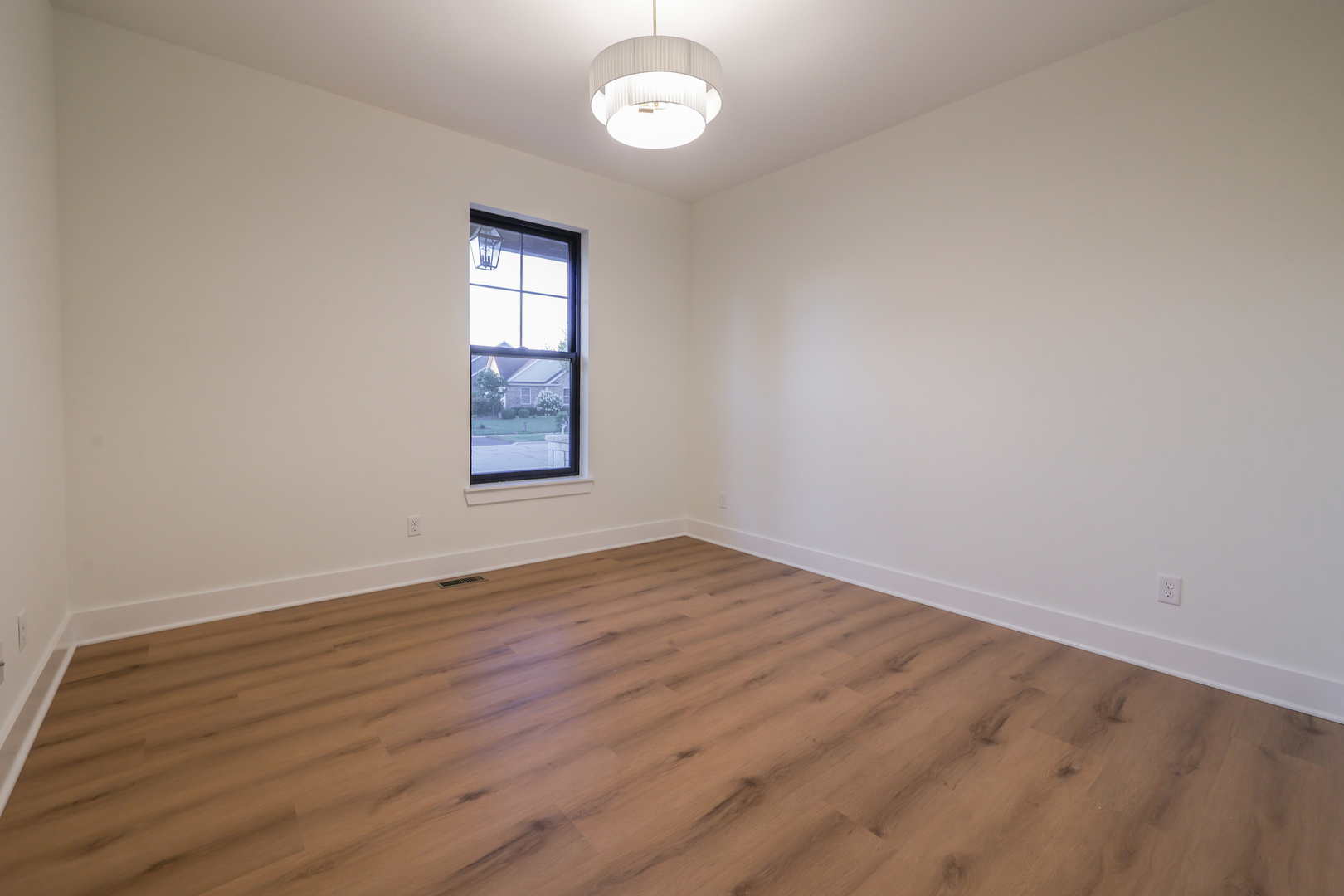 1823 Constitution Street Sycamore, IL 60178 - Photo 21 of 26 an empty room with wooden floor and windows
