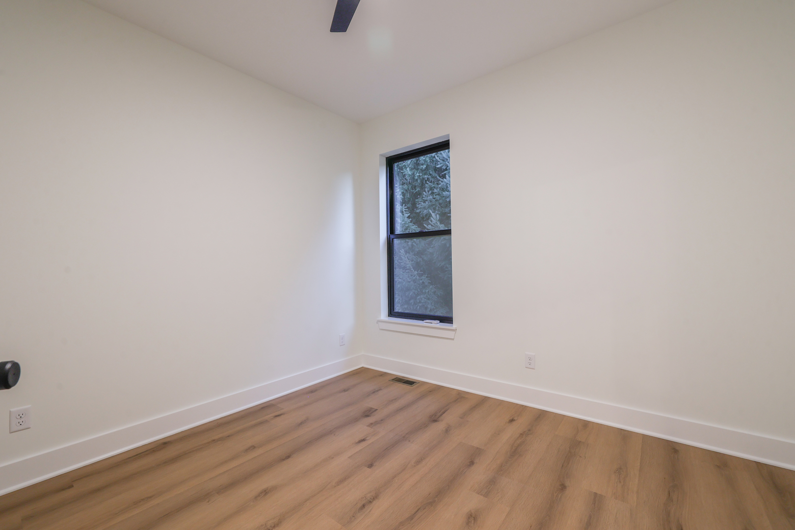 1823 Constitution Street Sycamore, IL 60178 - Photo 23 of 26 a view of an empty room with wooden floor and a window