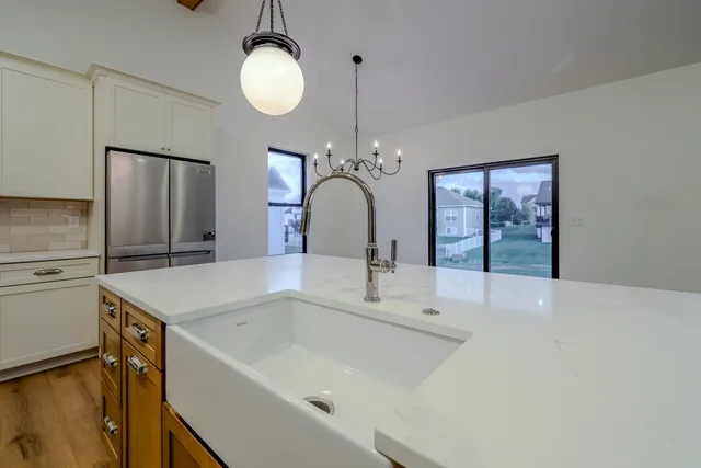 a bathroom with a sink vanity and a mirror