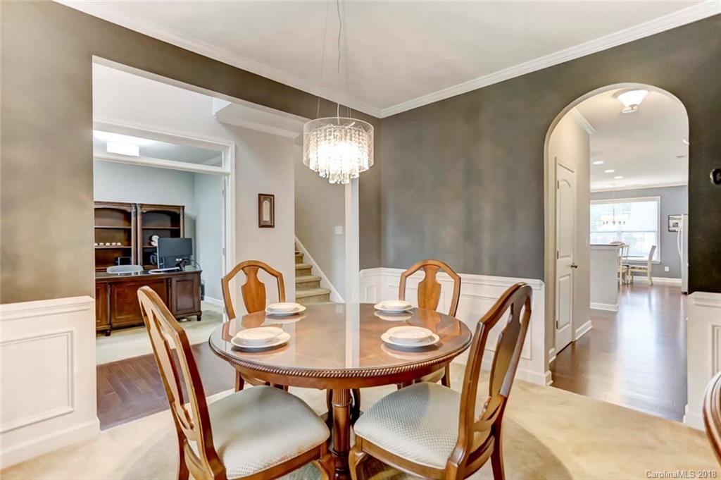 516 Rosemary Lane Fort Mill, SC 29708 - Photo 13 of 36 a view of a a dining room with furniture and wooden floor