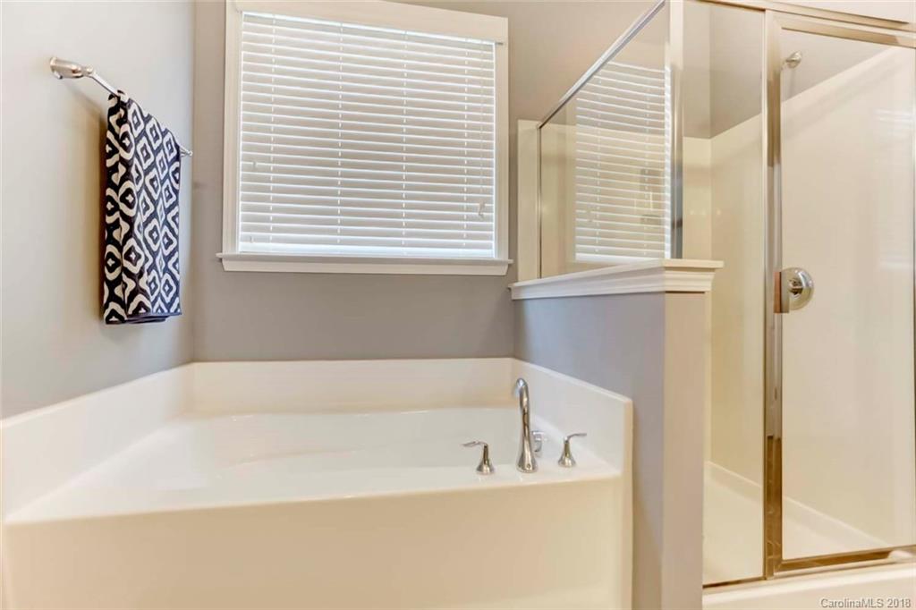 516 Rosemary Lane Fort Mill, SC 29708 - Photo 19 of 36 a white bath tub sitting next to a window