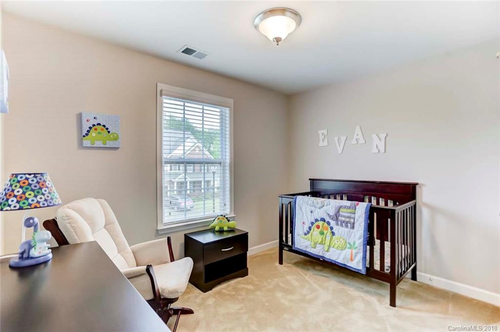 516 Rosemary Lane Fort Mill, SC 29708 - Photo 22 of 36 a bedroom with a bed and a window