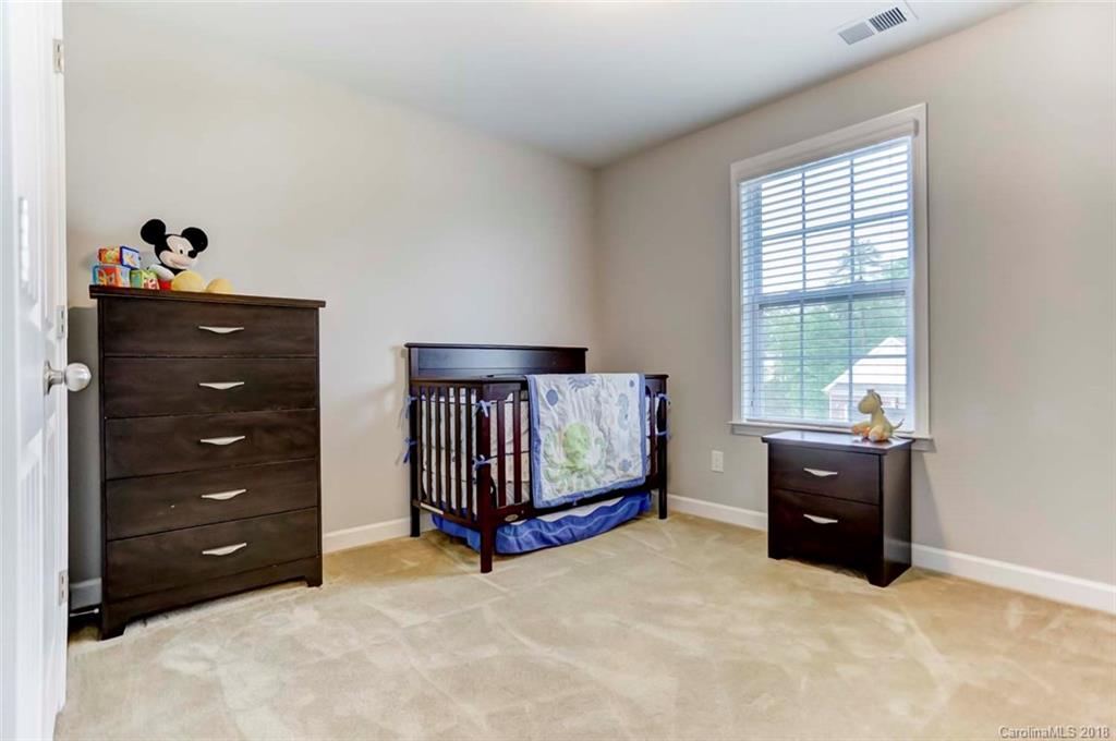 516 Rosemary Lane Fort Mill, SC 29708 - Photo 23 of 36 a bedroom with a bed and a window
