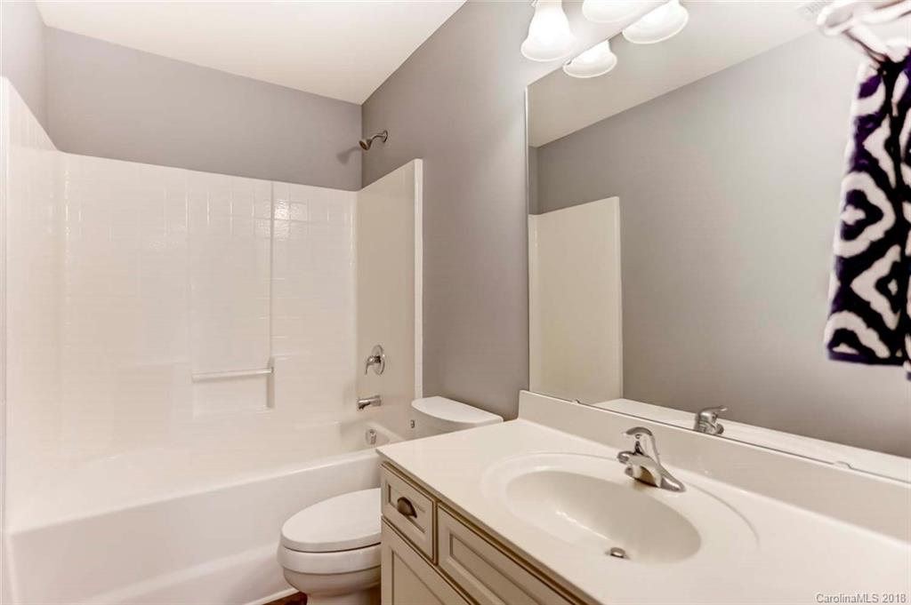 516 Rosemary Lane Fort Mill, SC 29708 - Photo 24 of 36 a bathroom with a sink a toilet and a large mirror