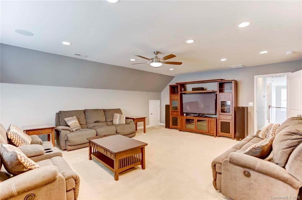 516 Rosemary Lane Fort Mill, SC 29708 - Photo 25 of 36 a living room with furniture and a flat screen tv